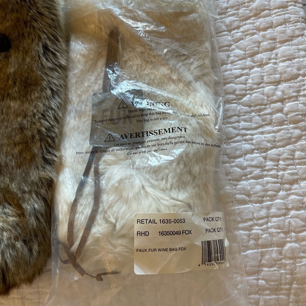 Pottery Barn Wine Bag in faux white fox Brand new and unused.